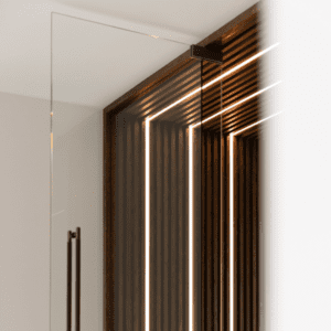 Custom LED lighting embedded in a sleek wooden wall and ceiling panel, in a Yorkshire residence